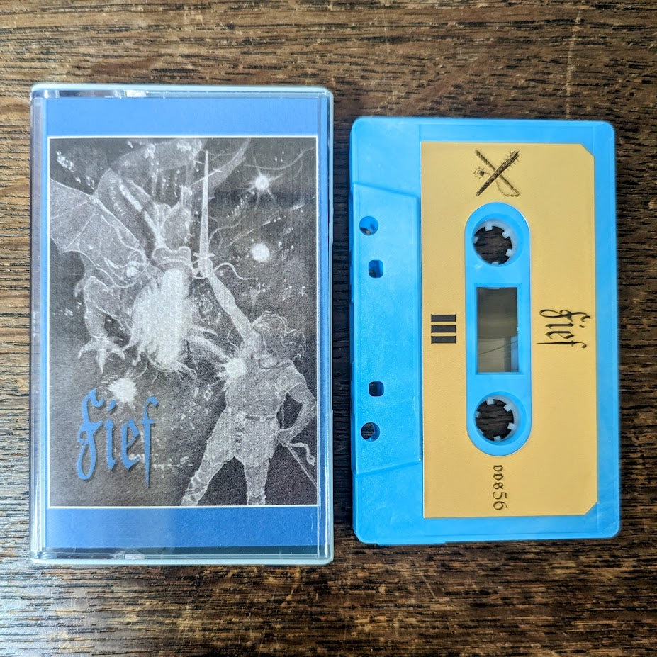 Fief III cassette tape, with a blue shell and gold printed label. 