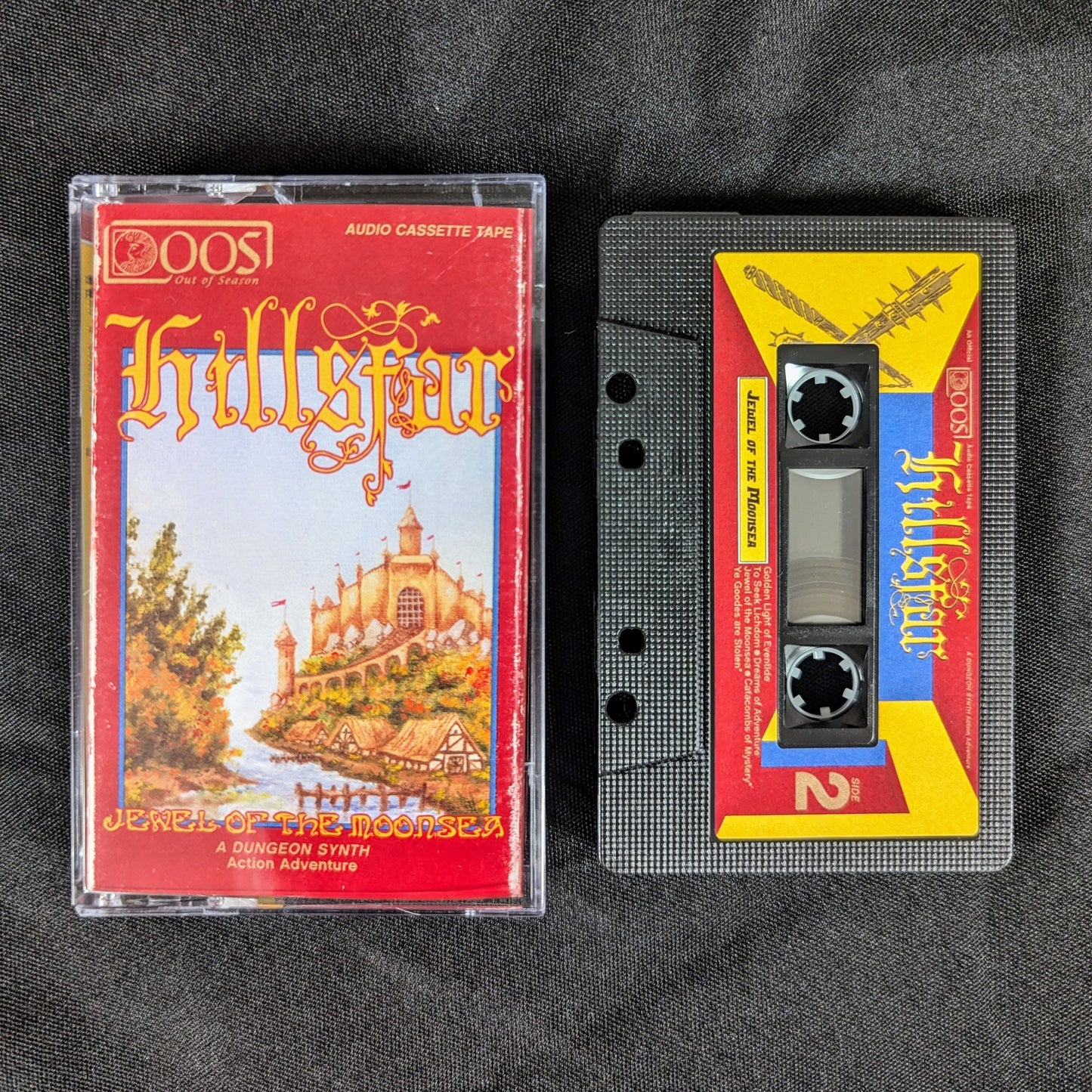 HILLSFAR Jewel of the Moonsea cassette tape, with black shell, multicolor sticker label, and Norelco case